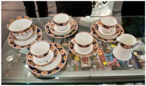 Part Tea Set by Wild Brothers, Stoke on Trent comprising four cups, six side plates and saucers,