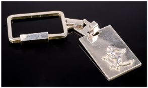 Skiing Interest. An Unusual Silver Keyring featuring a skier in action against a rectangular