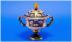 Royal Crown Derby Imari Patterned Lidded Two Handled Pedestal Vase, with pineapple finial. Date