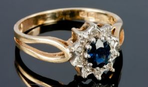 9ct Gold Diamond And Sapphire Cluster Ring, Central Dark Sapphire Surrounded By 10 Round Cut