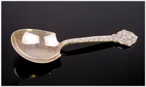 A Silver Caddy Spoon with Celtic Strap work Handle. Jubilee hallmarks for Sheffield 1977 by C.B.