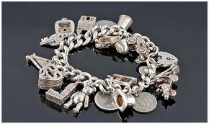 Sterling Silver Vintage Charm Bracelet, loaded with 20 charms of good quality. All marked silver.