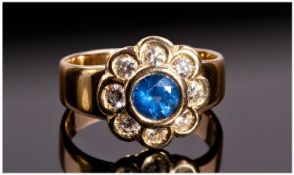 18ct Gold Diamond and Sapphire Flowerhead Shaped Cluster Ring with rubover setting. Fully