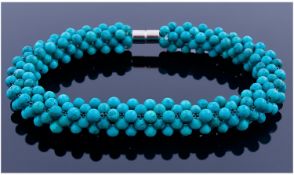 Turquoise Woven Bracelet, comprising dozens of small round turquoise stones `woven` into a flexible
