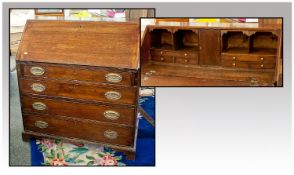 Georgian Oak Bureau with four graduated long drawers, on bracket feet with a fitted drawer.