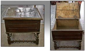 A Late Seventeenth Century Oak Lidded Box Stool. On bobbin turned stretchers and baluster shaped