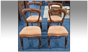Set Of Four Mahogany Kidney Shaped Backed Victorian Chairs, with over stuffed seats on reeded legs.