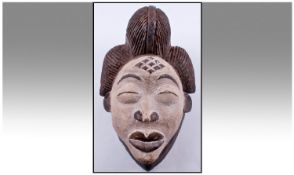 African Punu Mask. White face. Height 13 inches.