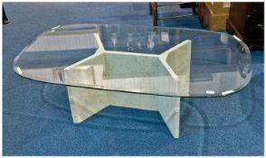 Contemporary Coffee Table With A Shaped Oval Glass Top, with an inch bevelled edge. The base with a