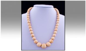 An Antique Graduated Ivory Necklace. Measures 19 inches in length.