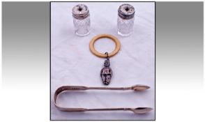 A Collection Of Silver Items, 4 In Total. 1, baby`s silver rattle, hallmark Birmingham 1902. 2,