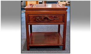 Chinese Rosewood Side Pedestal Table with carved front drawer and a shelf below. Recessed moulded