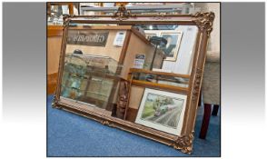 Large Rectangular Mirror, Broad Gilt Frame, With Moulded Decoration. 37 x 54 Inches