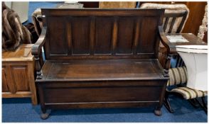 Oak Panelled Monks Bench With Hinged Seat. Height 37 x 48 Inches Wide