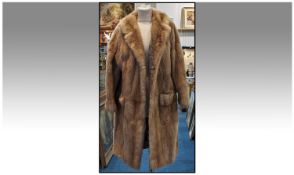 Blonde Mink Knee Length Coat, fully lined. hook and hoop fastening with deep pockets. Approx size