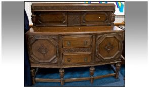 Early 20thC Carved Oak Sideboard, Three Central Drawers Between Two Cupboards, Raised On Turned And