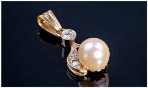 14ct Gold Set Pearl and Diamond Pendant Drop. 1 1/4 inches high.