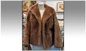 Medium Brown Squirrel Short Jacket, slit pockets and fully lined. Label to interior reads ` T B