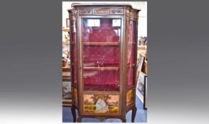 Ormolu Mounted French Vitrine With Shaped Concave Glass Sides. Shaped pink marble top with an