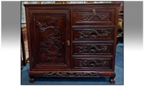 Chinese Rosewood Carved Front Side Cabinet of Unusual Form with a bank of 4 drawers to one side,