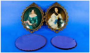 Pair Of Oval Brass Frames With Pierced Rococo Decoration, containing two portraits. Together with