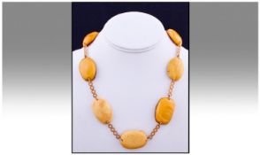 9ct Gold And Amber Necklace. 20 inches in length. Total weight 41.3 grams.