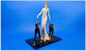 Modern Figure Group of Princess Diana and Her Dogs. on rectangular plinth. 17 inches in height.