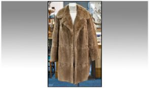 Mid Brown Musquash Three Quarter Length Coat, fully lined in very good condition. Label to interior