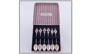 A Fine Set Of Six Silver Sri Lankan (Ceylonese) Spoons. Each traditional handle set with a cabochon