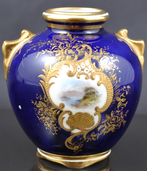 Coalport ovoid cabinet vase, painted with Lakeland Vignette on a Royal blue ground, 8cm.