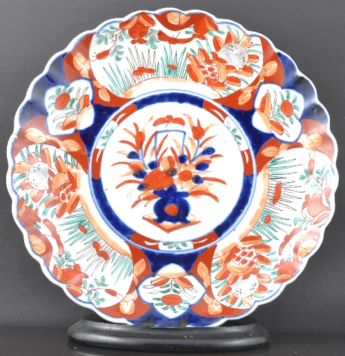 Imari circular charger, lightly lobed, centre decorated with a basket of flowers, diameter 31cm,