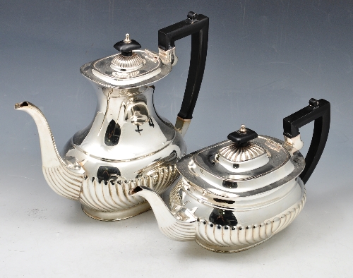Electroplated four piece tea and coffee set, semi fluted oval form, coffee pot and tea pot with