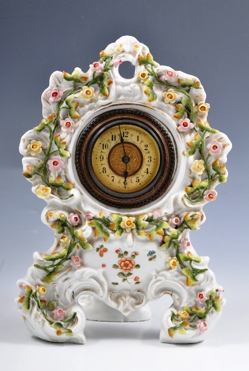 Continental porcelain mantel clock, encrusted and painted decoration with roses, No. 1037, 23cms.