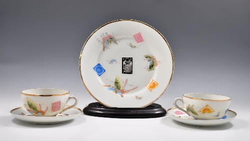 Collection of Japanese bone china tea wares, painted with tromp l'oeil postage stamps, further