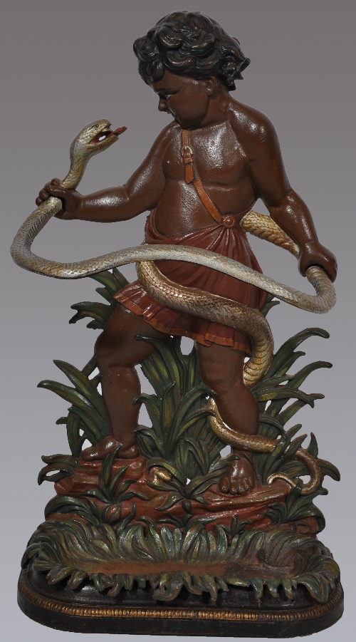 A Victorian painted cast iron stick stand, cherub and serpent design,
height 83cms, width 47cms.