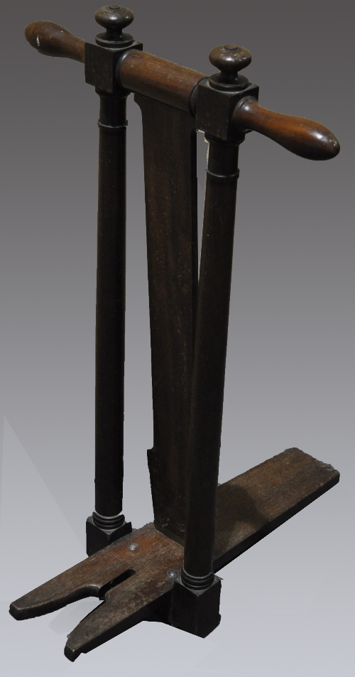 A Victorian mahogany boot jack, turned uprights, 88cms.