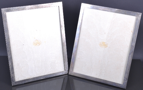 A pair of rectangular silver photograph frames, by The Goldsmiths & Silversmiths Company, London