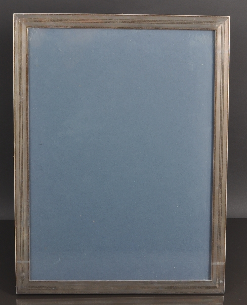 A rectangular silver photograph frame, Stokes & Ireland  Limited, Chester 1922, narrow frame, with