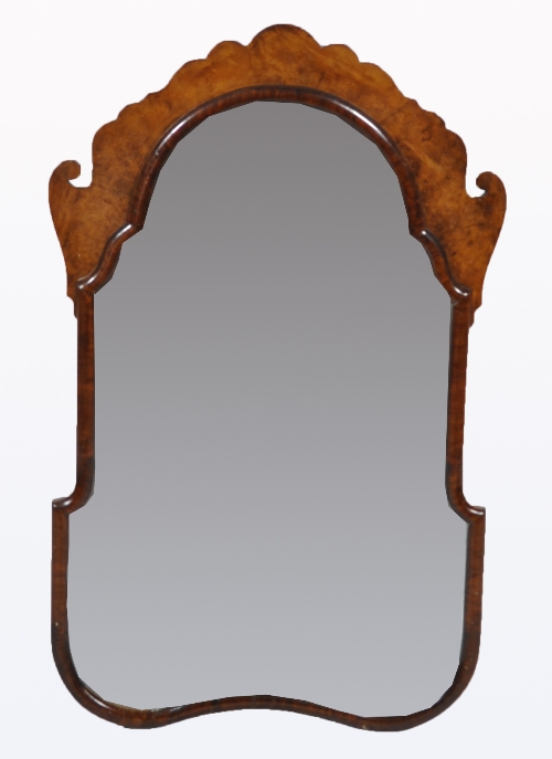 A burr walnut wall mirror, cartouche-shape frame, scallop and scrolled outlines to the cresting, 
88