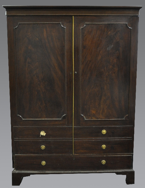 A Victorian mahogany wardrobe, cavetto moulded cornice, plain frieze, two doors incorporating panels