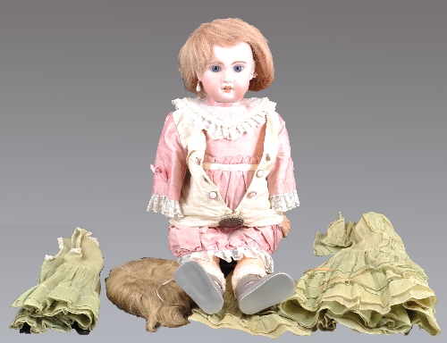 A Jumeau Bebe Mama and Papa bisque head doll, made for La Samaritaine Department Store in Paris, the