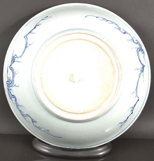 A Chinese porcelain blue and white shallow bowl, perhaps 19th Century, painted with flowering - Image 2 of 2