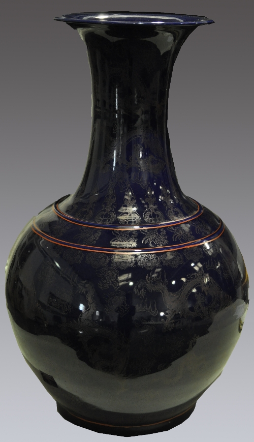 Chinese blue glazed floor vase, decorated with dragons and flaming pearls, 77cm.