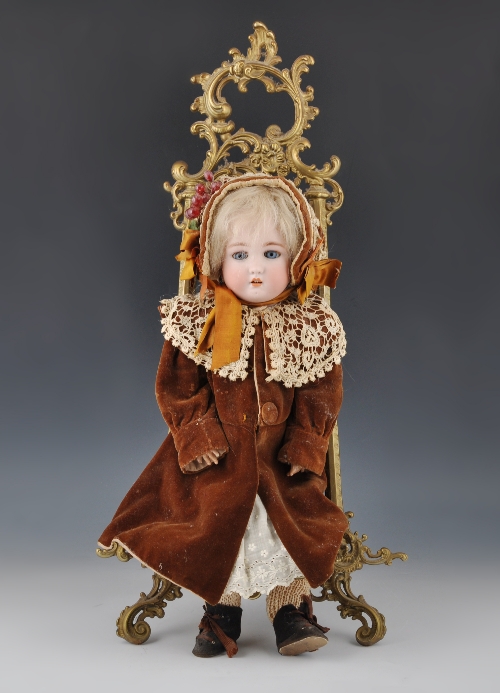 A Simon & Halbig bisque head doll, with original wig, sleeping blue eyes and delicate open mouth,