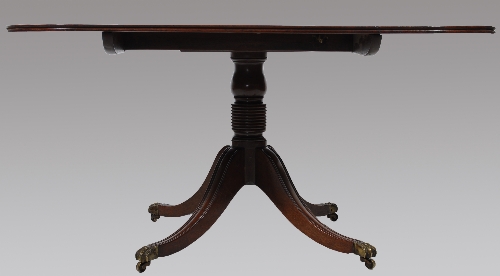 A George III mahogany pedestal breakfast table, rectangular tilt top with rounded corners, ringed