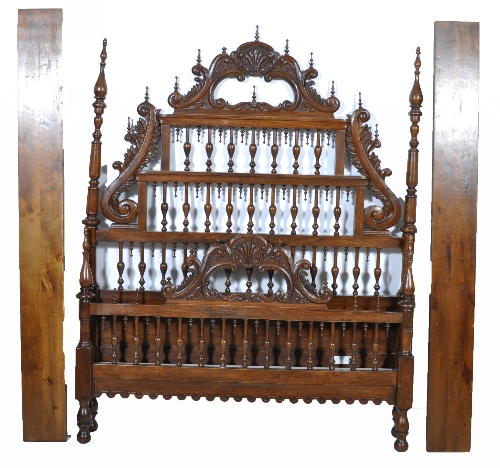 A Spanish oak and elm bedstead, carved scrolled cresting to the head and footboards, with balustrade