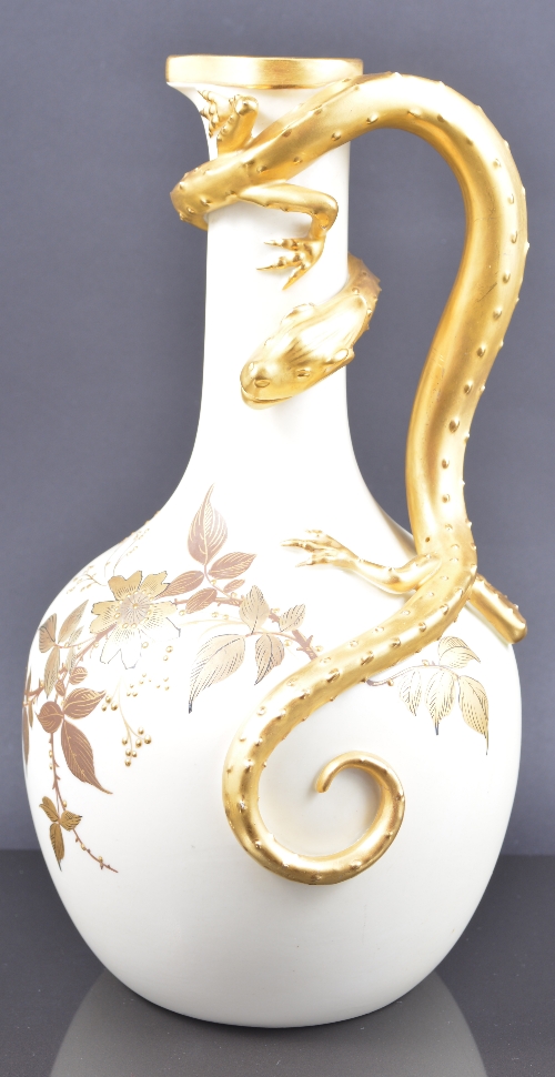 Royal Worcester ewer, date mark 1887, lizard handle, floral decoration on an ivory ground, 24cm