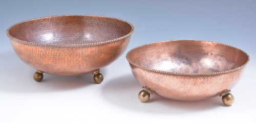 Two 'Dryad' Arts and Crafts copper bowls, circa 1915, hammered form with rope-twist rims, each