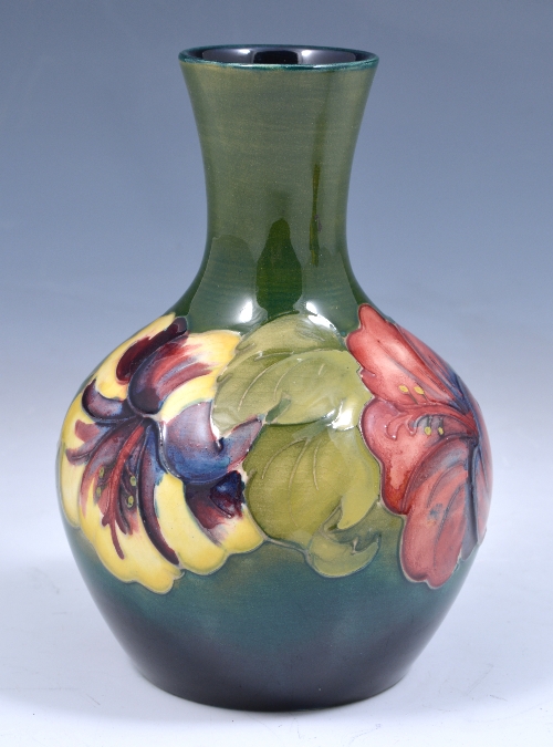 A Walter Moorcroft 'Hibiscus' vase, circa 1950, the short swollen body with short neck, impressed