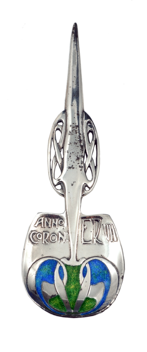 Archibald Knox for Liberty & Co., a 'Cymric' silver and enamel commemorative spoon, 1901, the handle